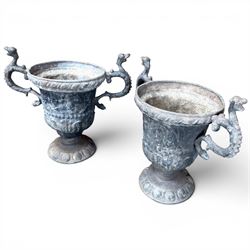 Impressive pair of early highly decorative lead garden urns, griffin handles with ornate decoration depicting cherubs and laurel wreath