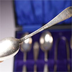 Set of  of six silver coffee spoons and tongs with bright cut decoration Sheffield 1908 Maker Cooper Bros. and another set of six coffee spoons with decorative terminals