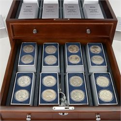 Thirty two United States of America silver dollar coins, 1879-1926, presented in Danbury Mint 'Historic US Silver Dollars' chest