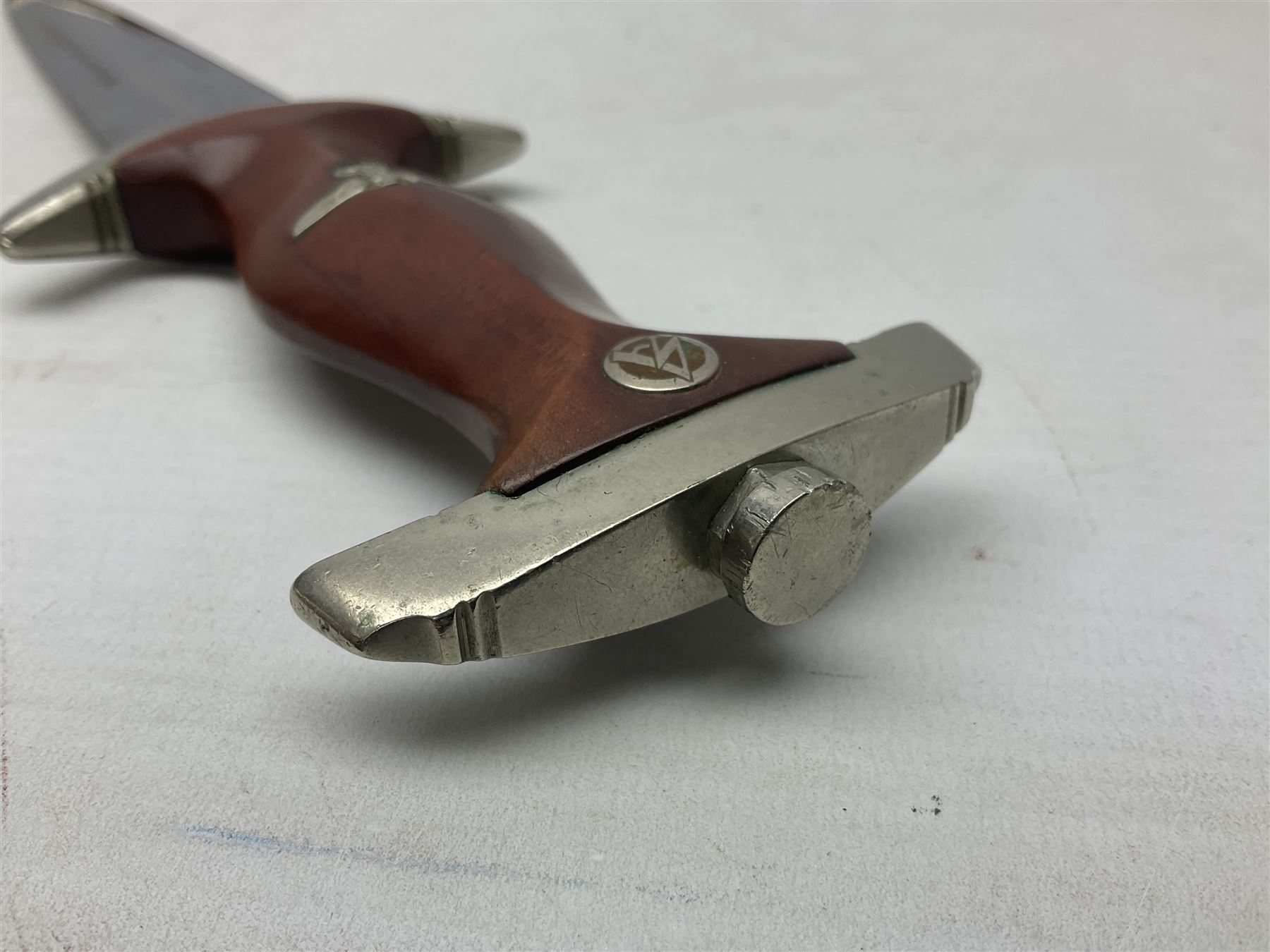 WW2 German SA dagger the 22cm double edged steel blade by G. Felix Gloriawerk Solingen inscribed 'Alles Fur Deutschland', the cross-piece impressed with the SA Gruppen mark Nm verso for Nordmark, wooden grip inset with eagle and SA emblem; in brown painted scabbard with nickel mounts L37cm overall