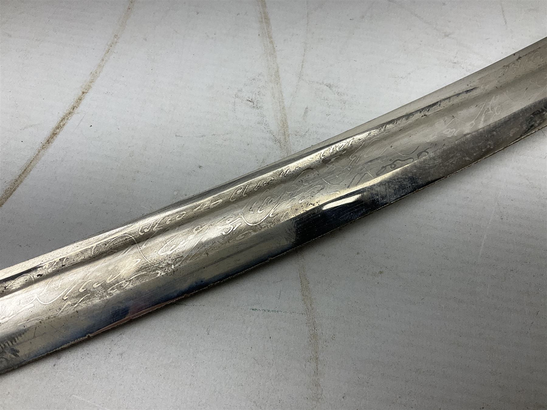 Early 20th century Indian ebonised sword stick, the 59.5cm blade with punched decoration and horn grip L94cm overall; and a reproduction Indian tulwar with scabbard (2)