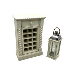 Contemporary painted wooden wine cabinet, rectangular form with carved leaf moulded cornice over single drawer and fifteen bottle compartments, flanked by spiral twist pilasters; together with a cream painted and chrome lantern, with glazed sides and leather handle (2)