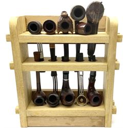 Pipes and two tiered wooden rack together with eleven pipers, including briar pipe carved as a wolf, Sea Dog straight pipe, John Brumfit pipe, meerschaum pipe ect, pipe rack H29.5cm