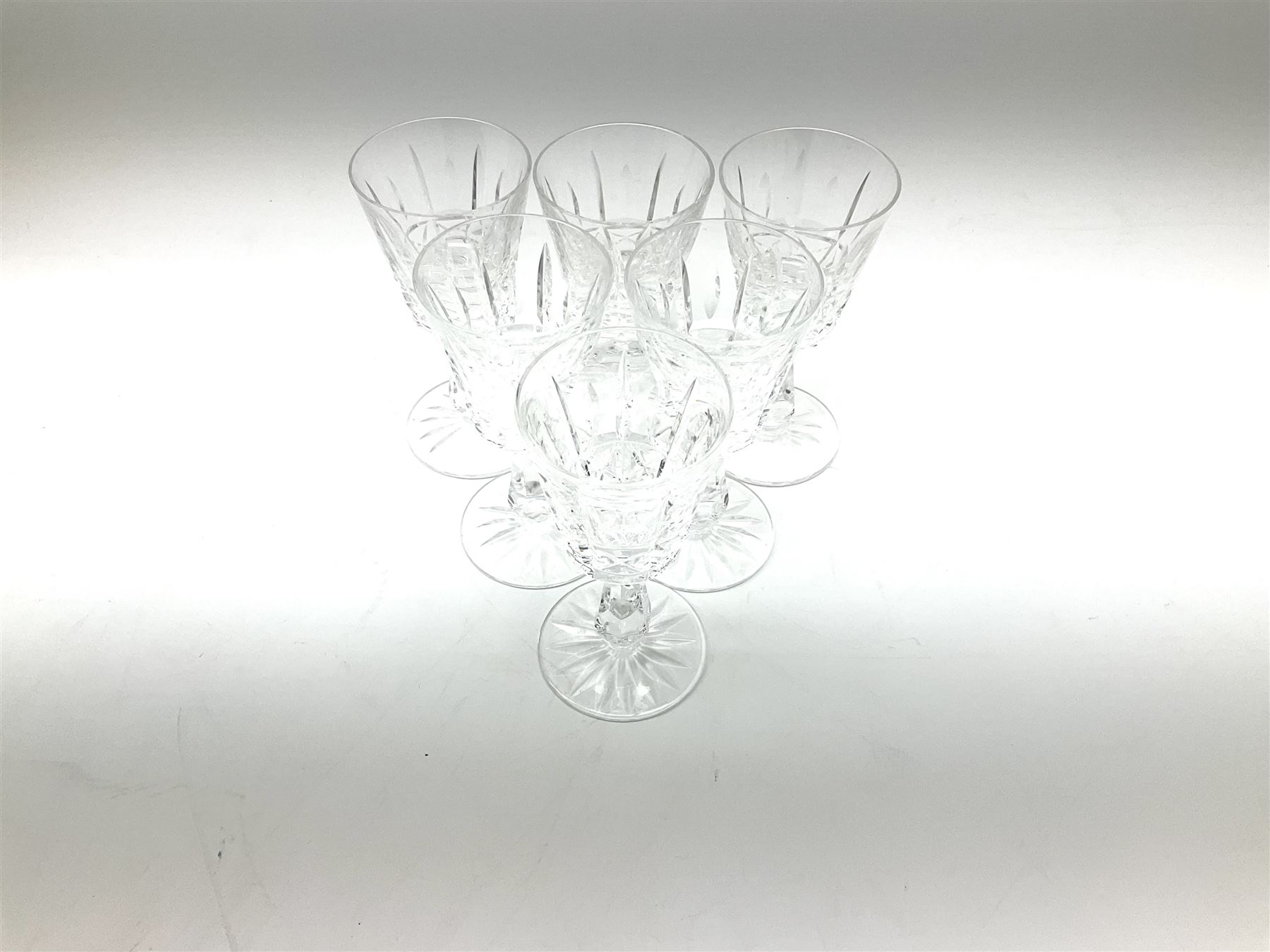 Set of six Waterford Crystal sherry glasses, together with three Stuarts Crystal Glengarry pattern flutes, a Stuart Crystal ships decanter, and an Edinburgh Crystal square section decanter. 