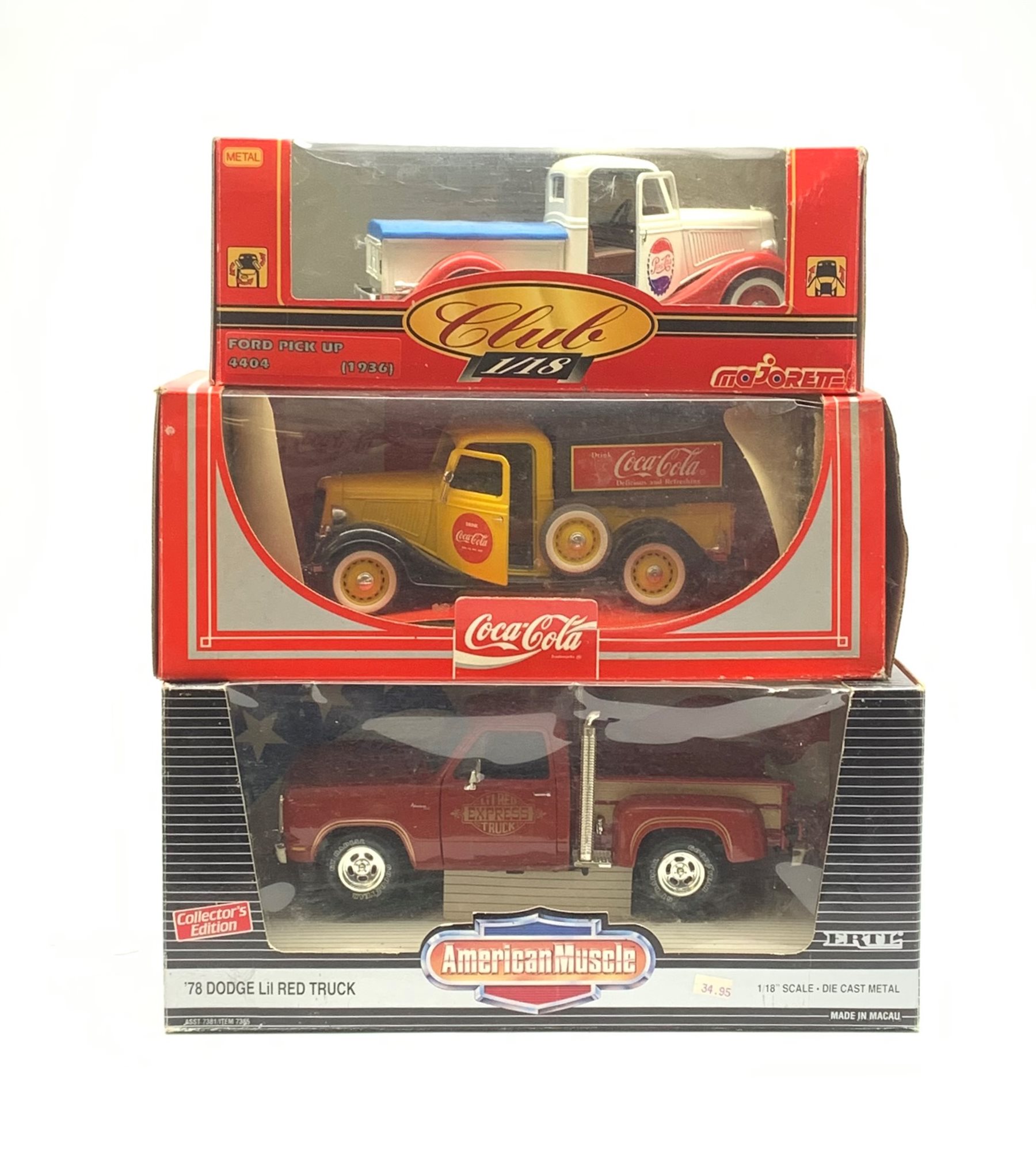 Three 1:18 scale die-cast trucks comprising Ertl American Muscle '78 Dodge Lil Red Truck, Majorette Club 1936 Ford Pick-Up and Hartoy Coca-Cola branded truck, all boxed (3)