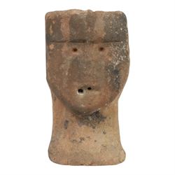 Sandstone carving, modelled as a stylised anthropomorphic head with simple facial features, H30cm