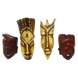  Two 19th/ early 20th century African carved bone face masks, H10cm and two Japanese hardwood Noh style masks (4) Provenance: private collection   