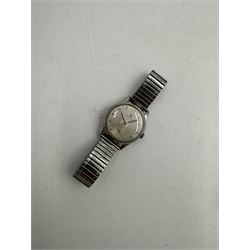 Omega gentleman's stainless steel manual wind wristwatch, Cal. 265, silvered dial with subsidiary seconds dial, on expanding strap and an Omega Constellation automatic wristwatch