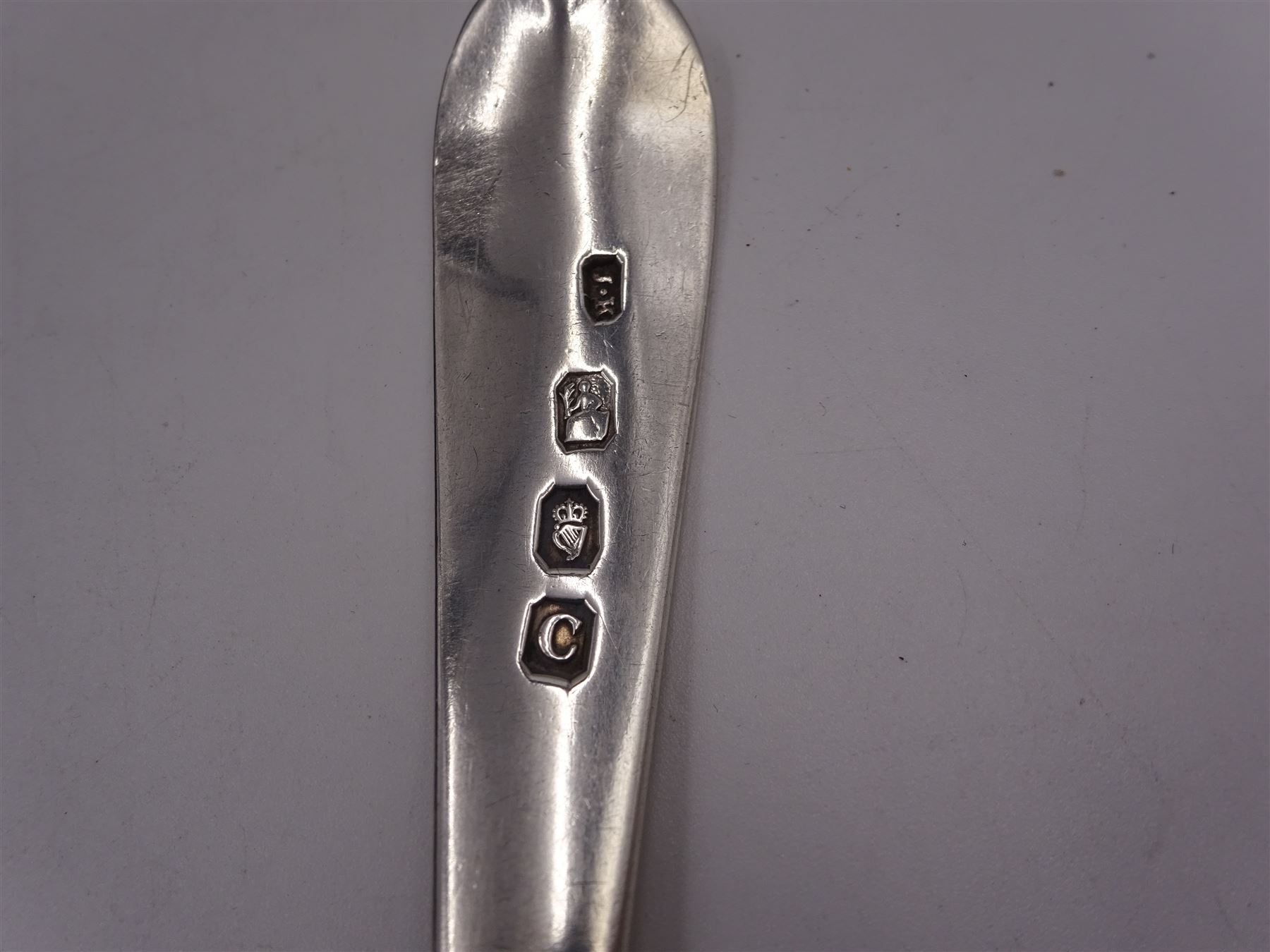 Five Irish silver spoons, comprising Old English pattern table spoon, hallmarked Dublin 1799, maker's mark JK, pair of George IV Fiddle pattern teaspoons, hallmarked James Scott, Dublin 1824 and two other Fiddle pattern teaspoons, the first example hallmarked Dublin 1837 and the second example hallmarked Dublin 1827, both maker's marks worn and indistinct, together with an early 20th century Britannia Standard silver teaspoon, with beaded scroll decoration and rattail bowl, hallmarked Thomas Bradbury & Sons, London 1903