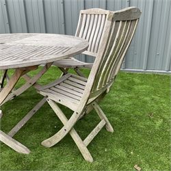 Teak circular garden folding table and five folding chairs  - THIS LOT IS TO BE COLLECTED BY APPOINTMENT FROM DUGGLEBY STORAGE, GREAT HILL, EASTFIELD, SCARBOROUGH, YO11 3TX