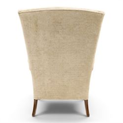 Parker Knoll - 'Hartley' lounge suite, comprising three wingback armchairs and two-seat settee, upholstered in cream fabric, shaped wing backs with scroll-over arms and loose seat cushions, on cabriole supports with pad feet wingbacks and settee

Armchairs: H 96cm, D 83cm, W 75cm