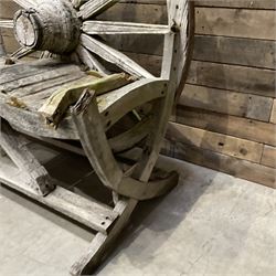 Early 20th century timber framed cartwheel garden bench
