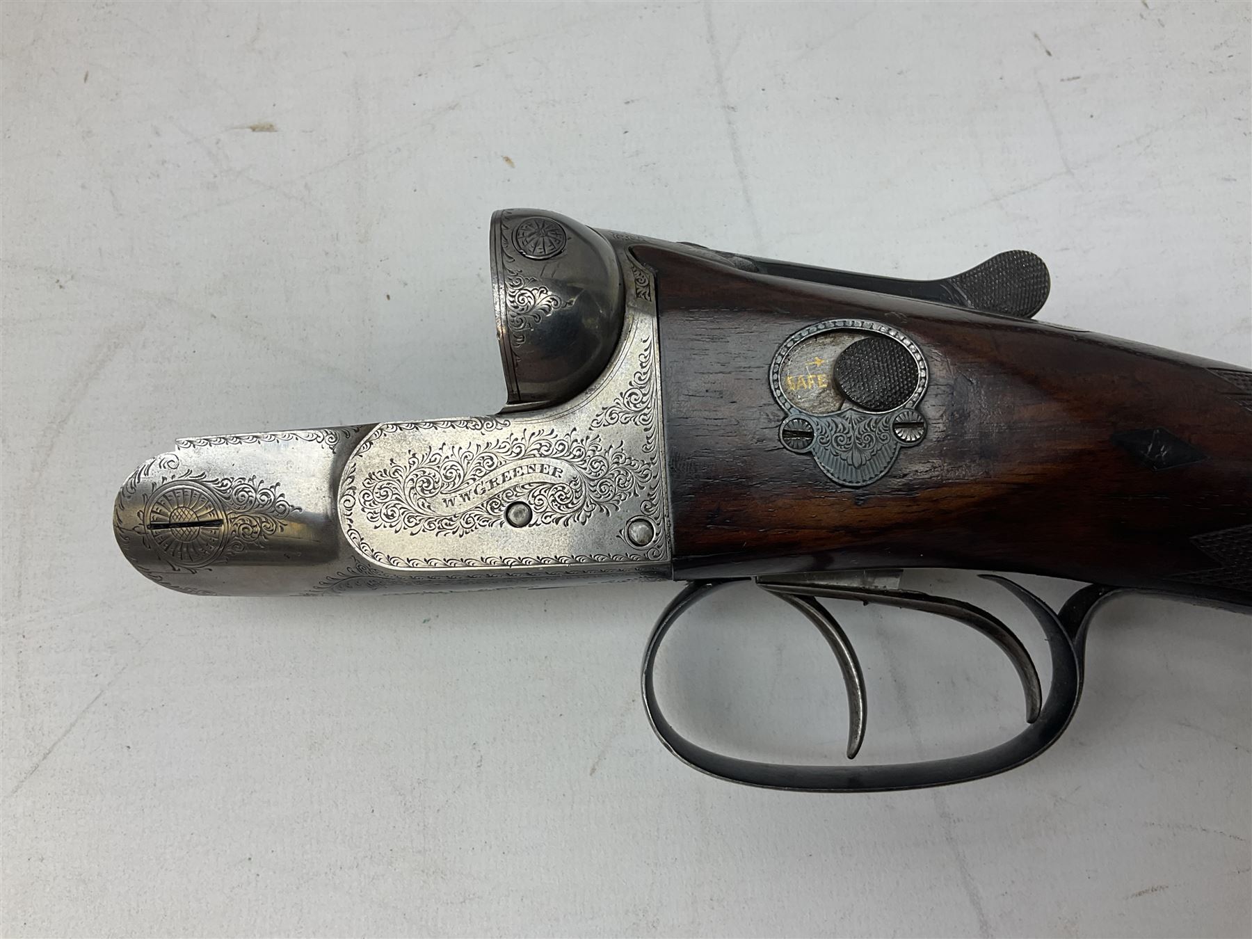 W.W. Greener 12-bore side-by-side double barrel non-ejector shotgun, with 76cm barrels, side safety, engraved lock, figured walnut stock with chequered grip and fore-end, no.33408, 120.5cm overall; in fitted canvas covered case with tools and accessories including .22 12-bore dog training device. SHOTGUN CERTIFICATE REQUIRED.