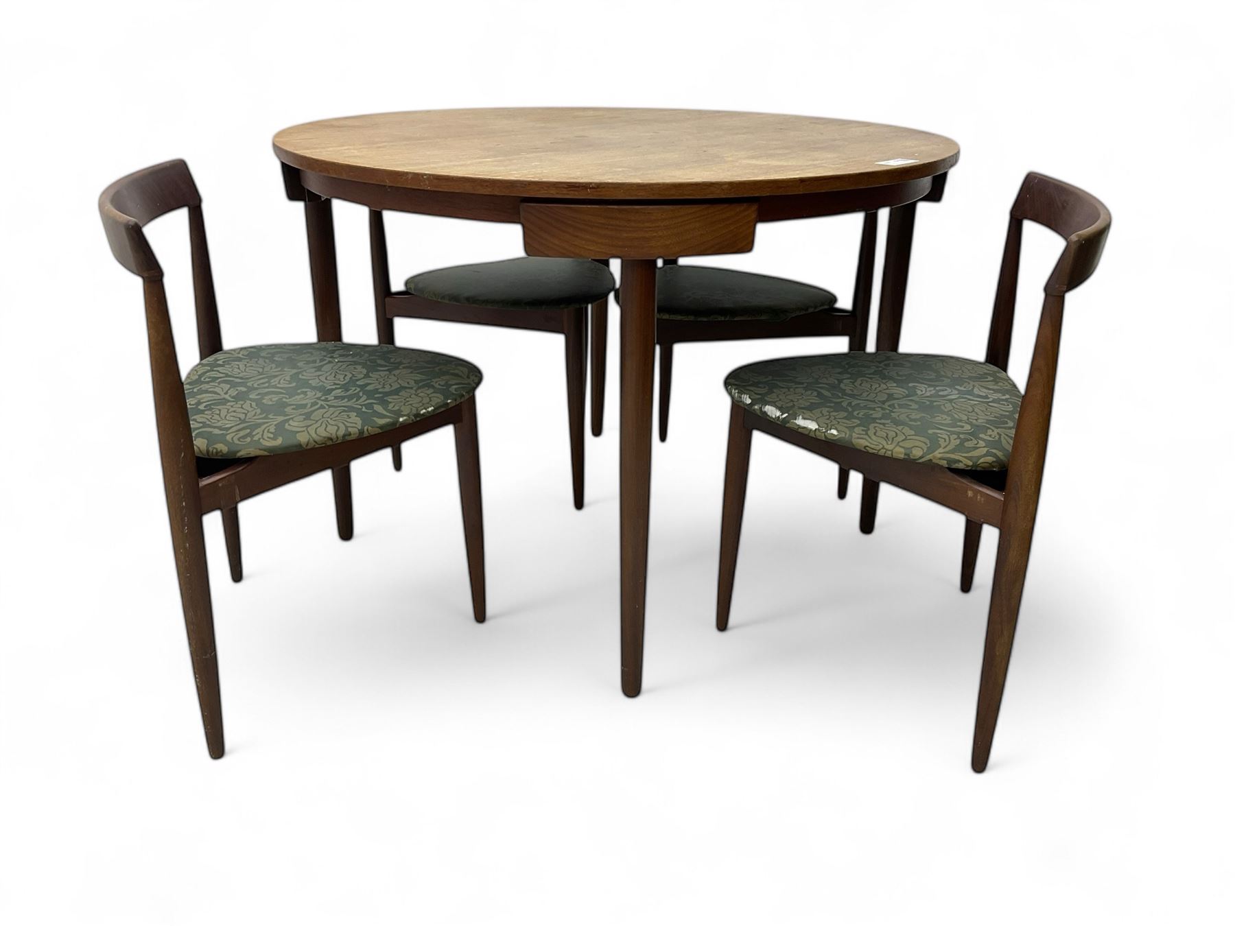 Hans Olsen for Frem Røjle - mid-20th century Danish teak 'Roundette' dining set, comprising a circular dining table raised on four tapering supports, paired with four matching chairs, each with a triangular seat upholstered in floral patterned fabric and raised on three tapering supports
