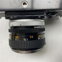 Canon F1n camera body, serial no. 572972, with 'Canon FD 50mm 1:1.4' lens, serial no. 246665, with leather case 