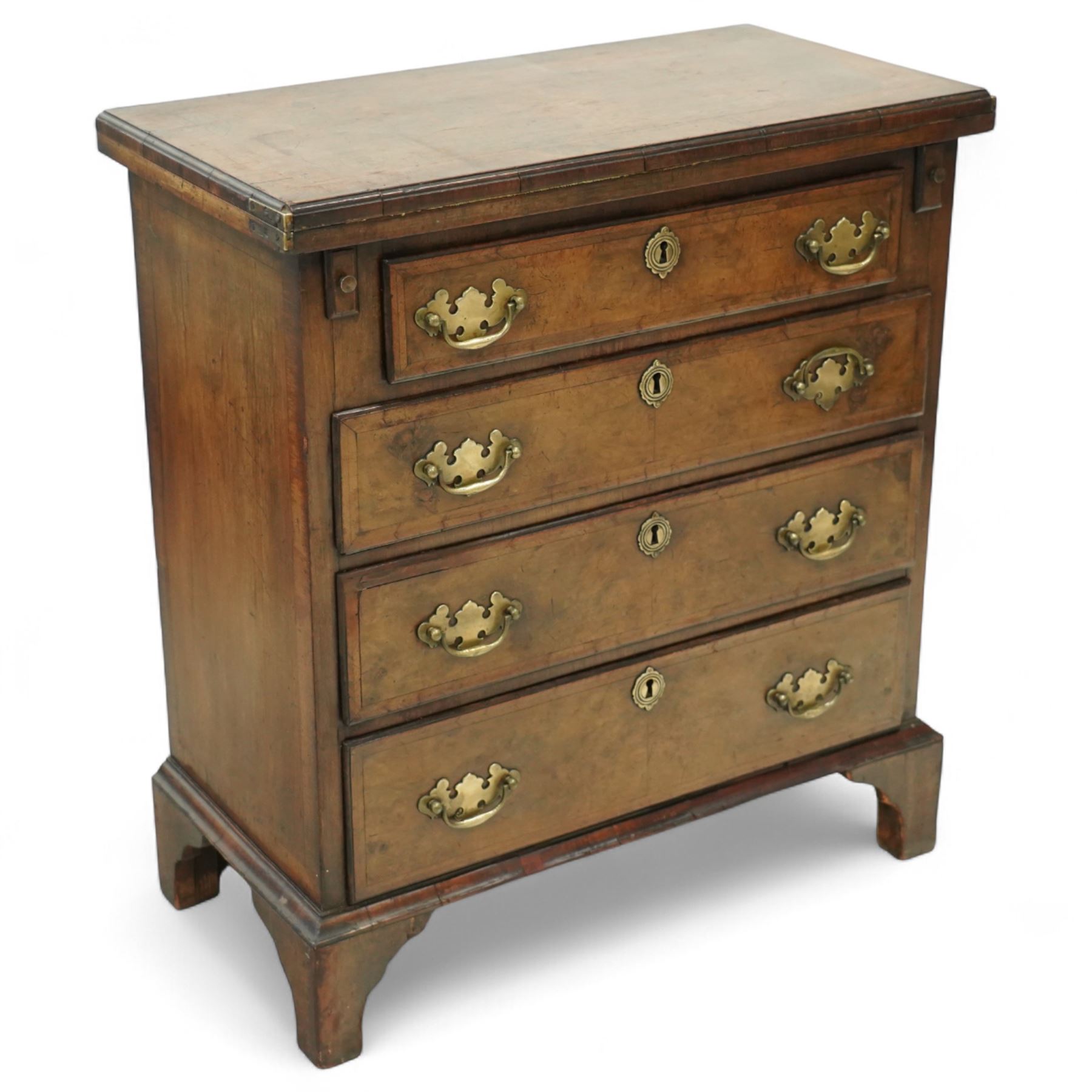 Mid-19th-century Georgian-style burr walnut bachelor's chest with feather-banding, hinged rectangular brushing slide above four graduated long drawers with brass batwing handles and escutcheons, raised on bracket feet  