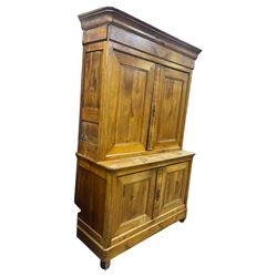 19th century French walnut dresser, the moulded cornice over two-panelled cupboard doors, enclosing two shelves and one small
drawer, on a base of two further cupboards