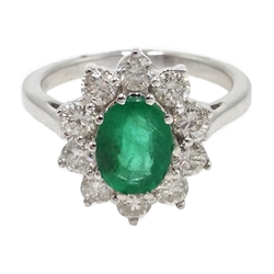  18ct white gold oval emerald and diamond cluster ring, stamped 750, emerald 1.20 carat, diamond total weight approx 1.00 carat  
