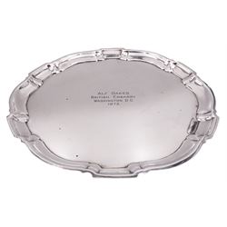 20th century silver salver, of circular form with Chippendale rim, and personal engraving to centre 'Alf Oakes British Embassy Washington DC 1973', marked Sterling by Poole, D29.5cm, approximate weight 23.59 ozt (733.7 grams)