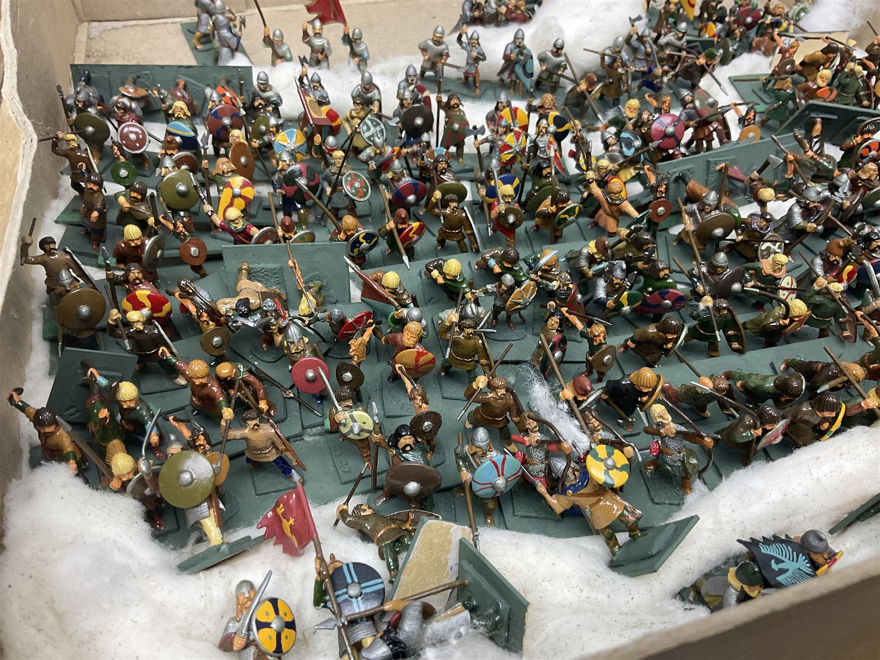 Painted metal wargame figures - over four hundred including Normans and Saxons, Romans, British Tribes etc; together with a quantity of part-painted and unpainted figures, battlefield weapons and accessories etc; average size 25mm