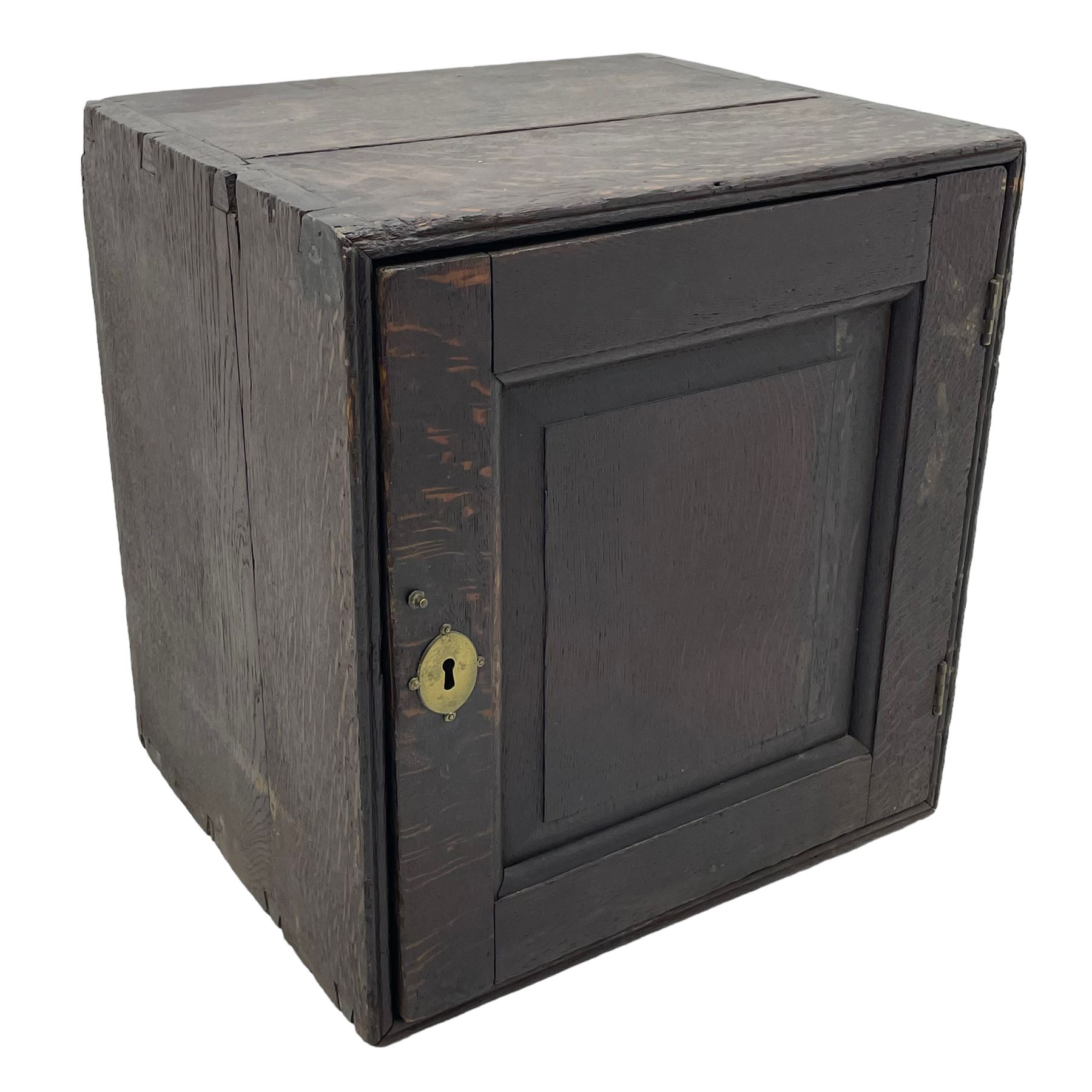 18th century oak spice cupboard, single panelled door enclosing eight drawers of various sizes, reed moulded front edges