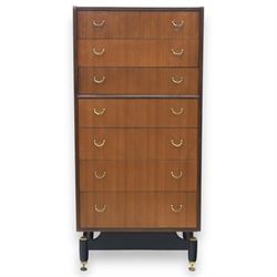 G Plan - 'Librenza' tola wood chest of seven drawers, gold coloured metal pulls on an ebonised based with gold coloured feet