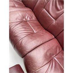 Ekornes 'Stressless' three seat sofa upholstered in cranberry leather and two matching footstoold