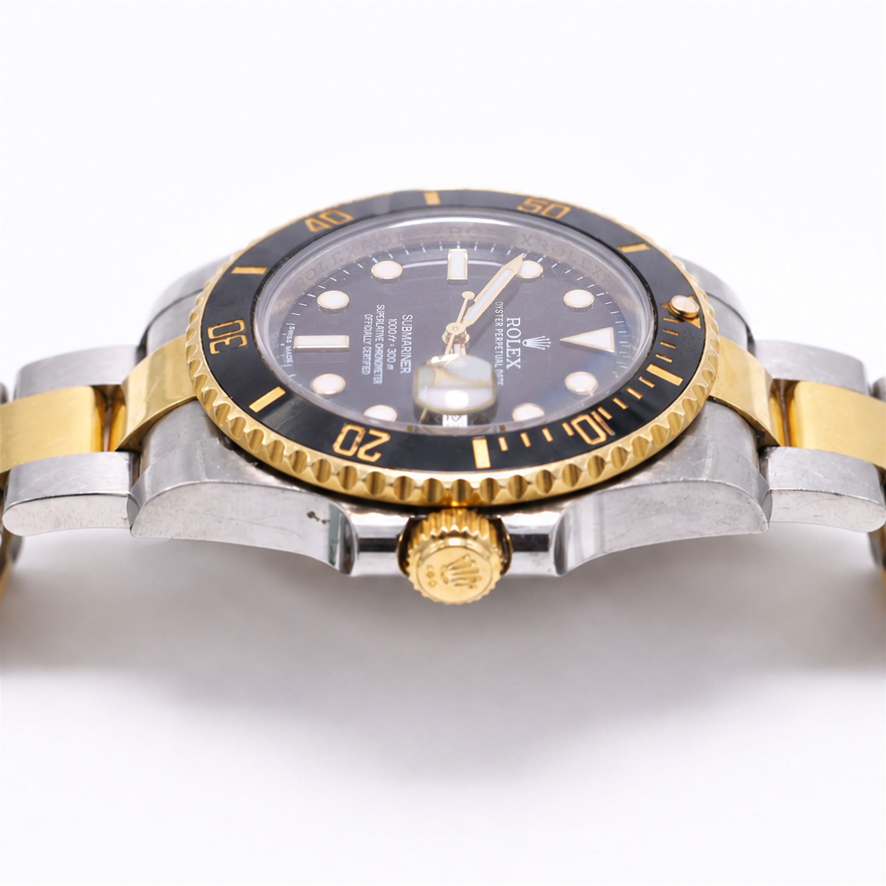 Rolex Oyster Perpetual Submariner Date gentleman's stainless steel and gold automatic wristwatch, Ref. 116613LN, serial No. 8201P7C5, back dial with luminous hour markers, unidirectional rotating black ceramic bezel, on stainless steel and yellow gold Rolex Oyster bracelet with fold-over clasp, boxed with guarantee card dated 2013