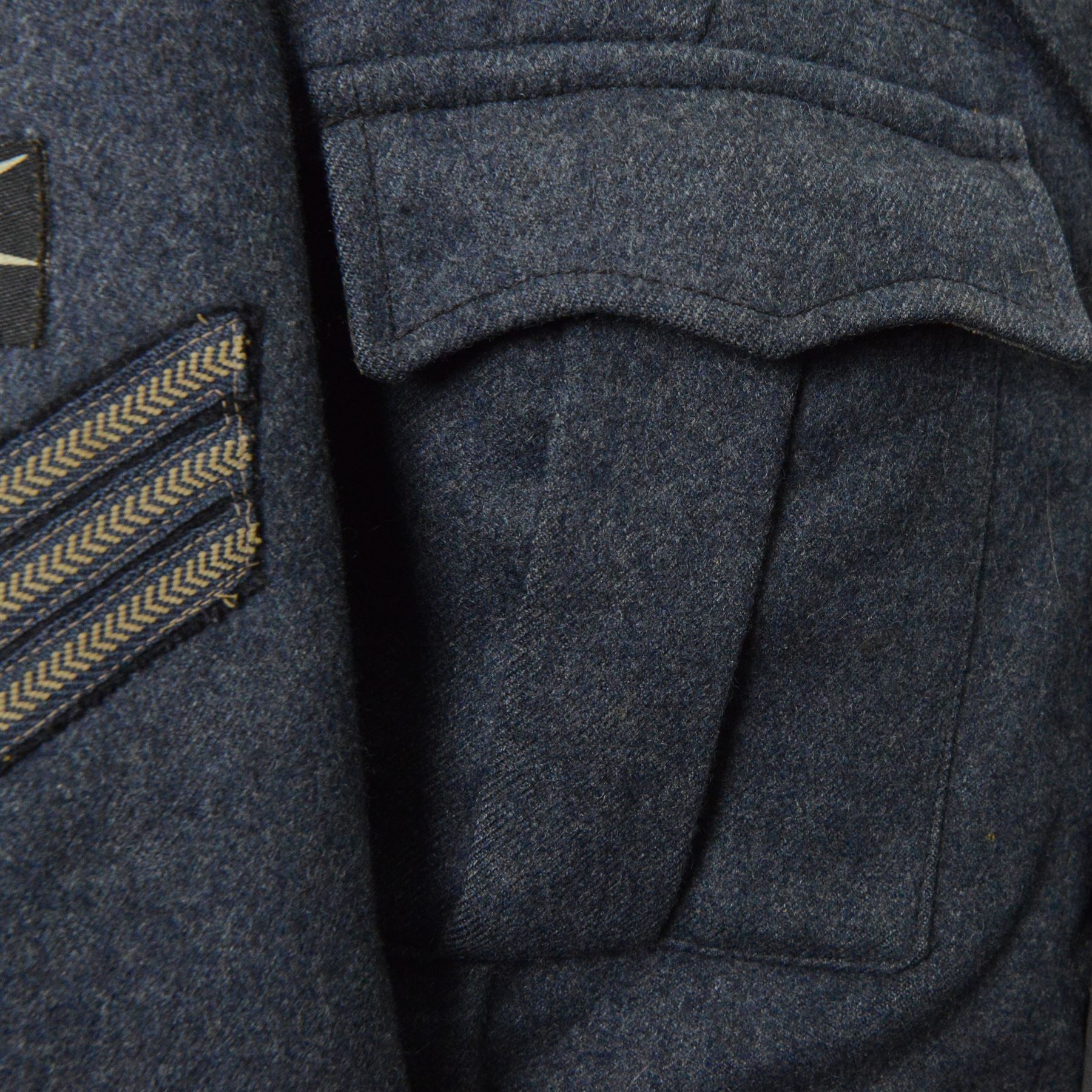 WWII Royal Air Force battle dress blouse, belonging to Flight Sargent Colin Scott 3011422, dated 1945, tailors label for M & N Horne Ltd 1945, Size No 7, blue cloth, Signaller cloth brevet, wireless officers patch to right sleeve and braid sergeant stripes to both sleeves, together with his flight log book, postings & Movements, Royal Air Force Service and Release Book, photographs etc  