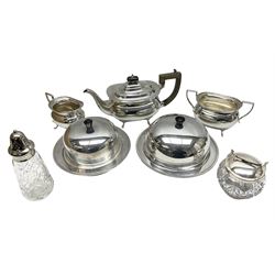 Silver plated three-piece tea set; two muffin dishes; cut-glass sugar caster; and sugar lump bowl with concertina action nips