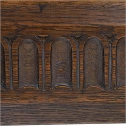 Rupert Griffiths for Monastic Woodcraft - oak 6ft refectory dining table with set six (4+2) matching chairs, rectangular top with arcaded frieze, with trestle base with further arcaded carved stretchers, chairs with carved rails and finials, leather wrapped seats with stud detail, turned supports united by carved stretcher