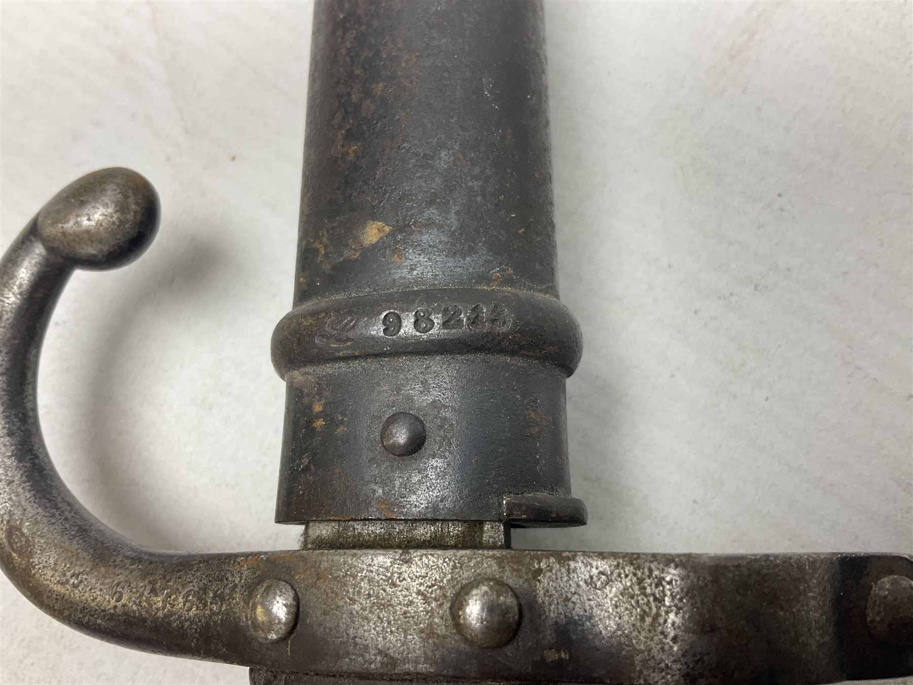 French Model 1874 Epee bayonet marked Oulle 1876 in associated scabbard; Model 1866 sabre bayonet in cut-down sword scabbard; and Model 1842/59 sabre bayonet in relic condition (3)