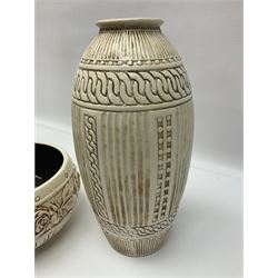 Bretby vase, of baluster form, with fluted and chain link decoration upon an ivory ground, together with a similar Bretby bowl, decorated with a band of roses upon an ivory ground, both with impressed marks beneath, and one other vase, with relief floral decoration and pewter cased rim, tallest H33cm