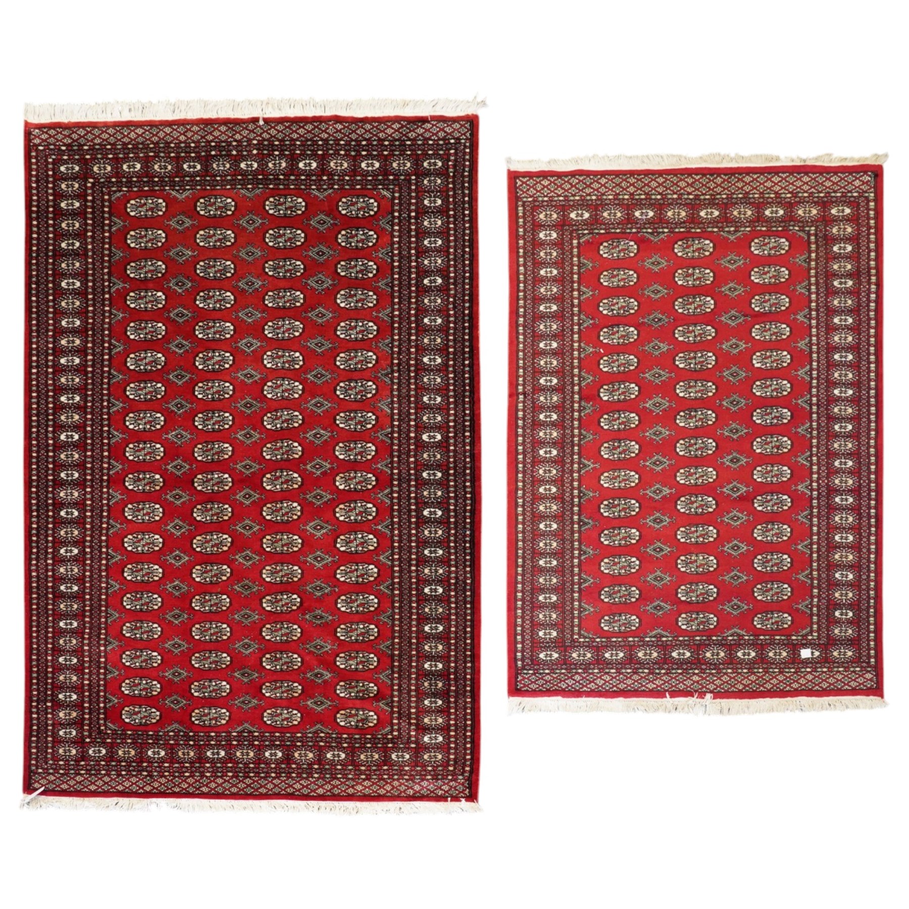 Two Afghan Bokhara crimson ground rugs, the fields decorated with repeating Gul motifs with geometric guard bands (126x190 & 157x250)