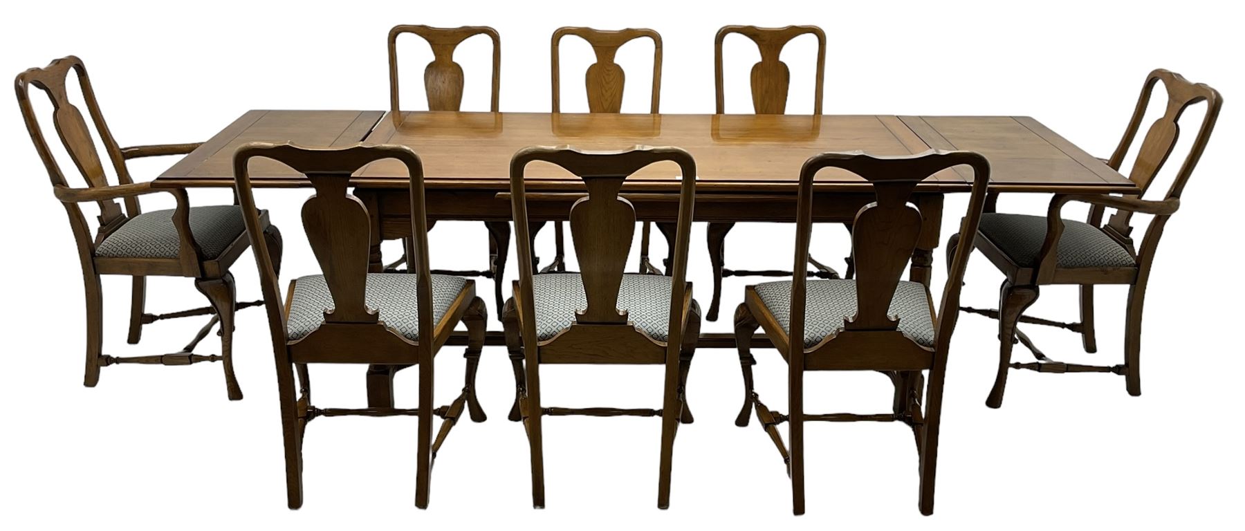Late 20th century oak dining table, rectangular top with two draw leaf extensions, on turned supports united by moulded hayrake stretchers (180cm - 278cm x 90cm, H76cm); set of eight (6+2) oak dining chairs, shaped cresting rail over shaped splat back, upholster drop-in seat, on cabriole supports united by turned H-shaped stretchers 