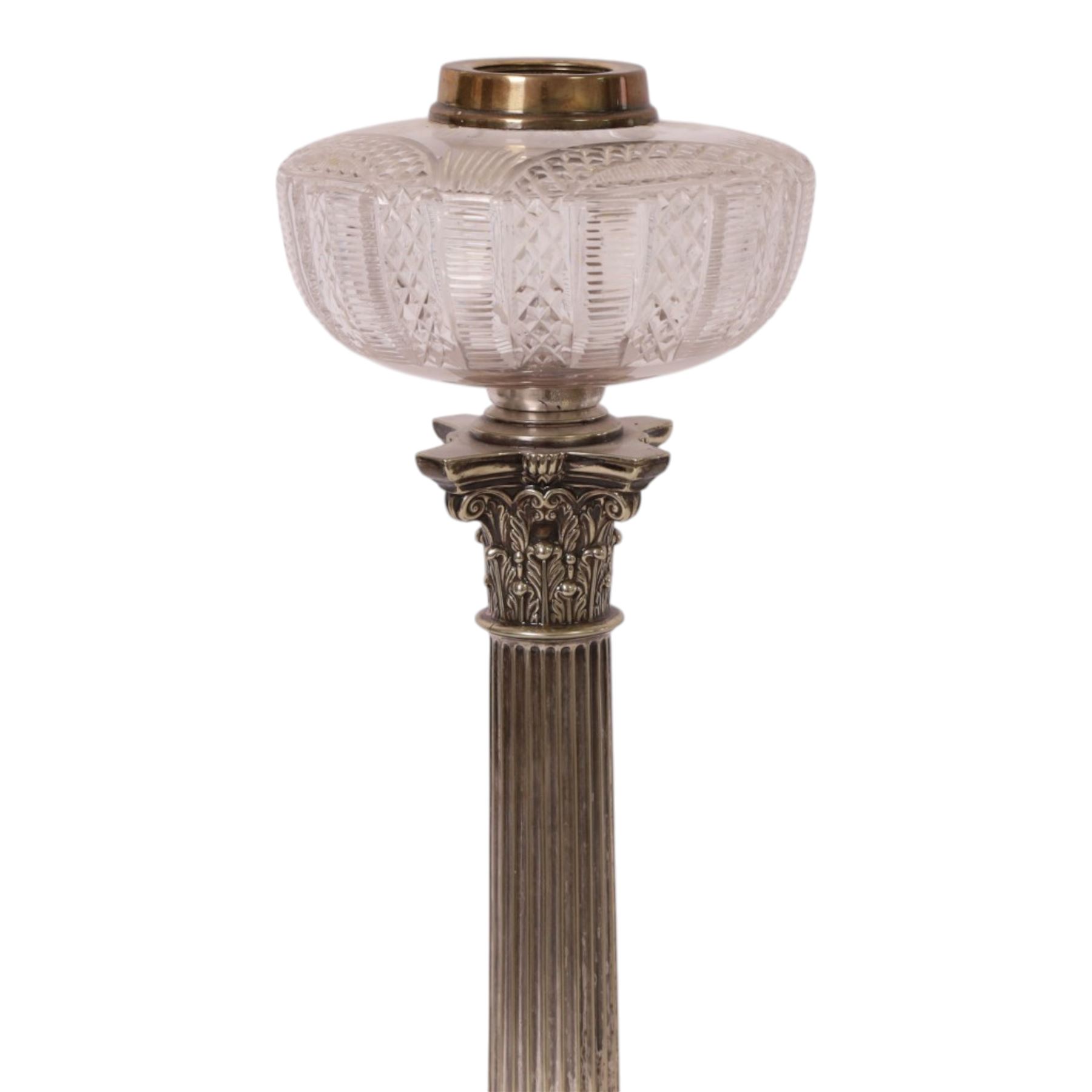 Victorian silver plated Corinthian column oil lamp, raised upon a stepped base, clear glass reservoir, H54cm 