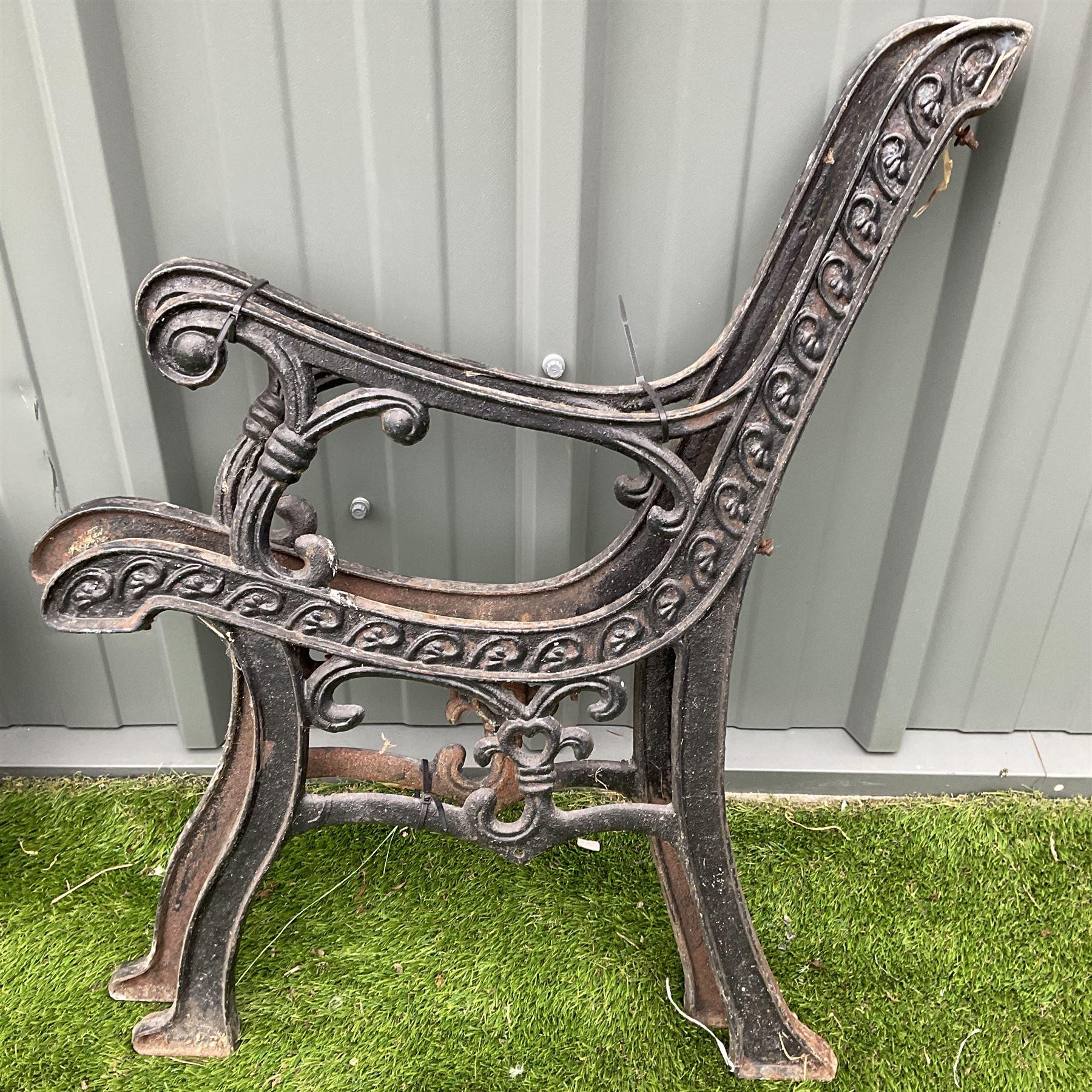 Cast iron garden seat ends and back painted in black THIS LOT IS TO