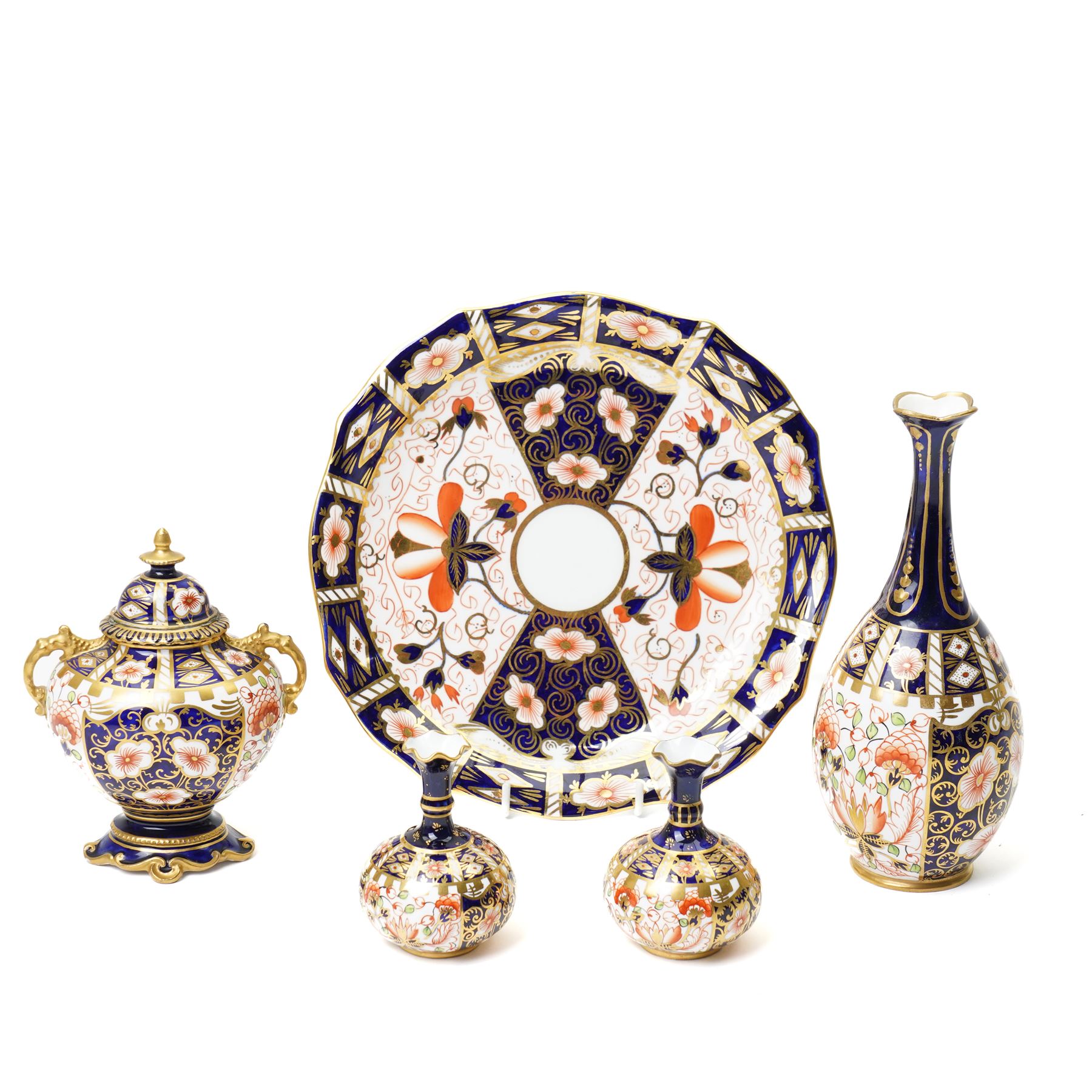 Mixed Royal Crown Derby Imari 6299 pattern wares, including a pair of vases, H8cm; covered twin handled urn, H14cm; slender vase, H19cm, and a pattern 2451 plate, D23cm (5)