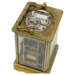 French - Early Edwardian corniche cased 8-day carriage clock, decorative enamel dial with floral garlands, Arabic numerals, minute markers, steel moon hands and conforming alarm setting dial, four rectangular glass panels and an oval viewing glass to the top, with a silvered lever platform escapement and 
timing screws to the jewelled balance, twin train rack striking movement with repeat, sounding the hours, half hours and alarm on a coiled gong.  Original traveling case with viewing glass and key.