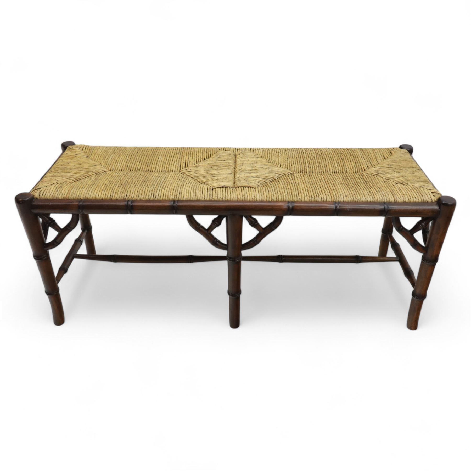 Faux bamboo long stool, stained beech frame with rectangular rush woven seat, rounded rail sides over ring-turned supports, united by side and end stretchers