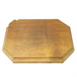 Mouseman - oak chopping board, of canted octagonal form with concave handles, with carved ...