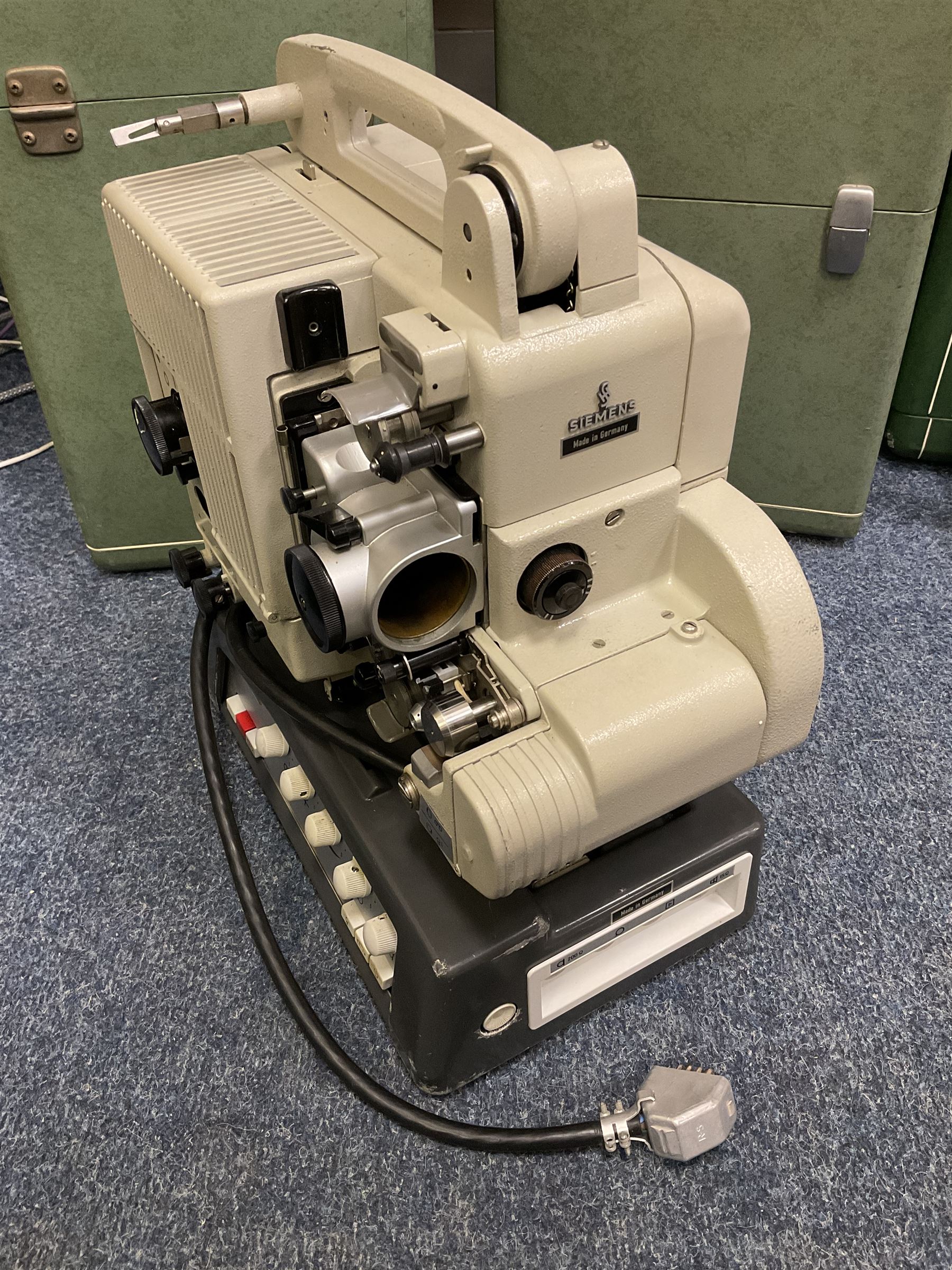 Group of vintage Siemens projectors and various speakers, all housed in