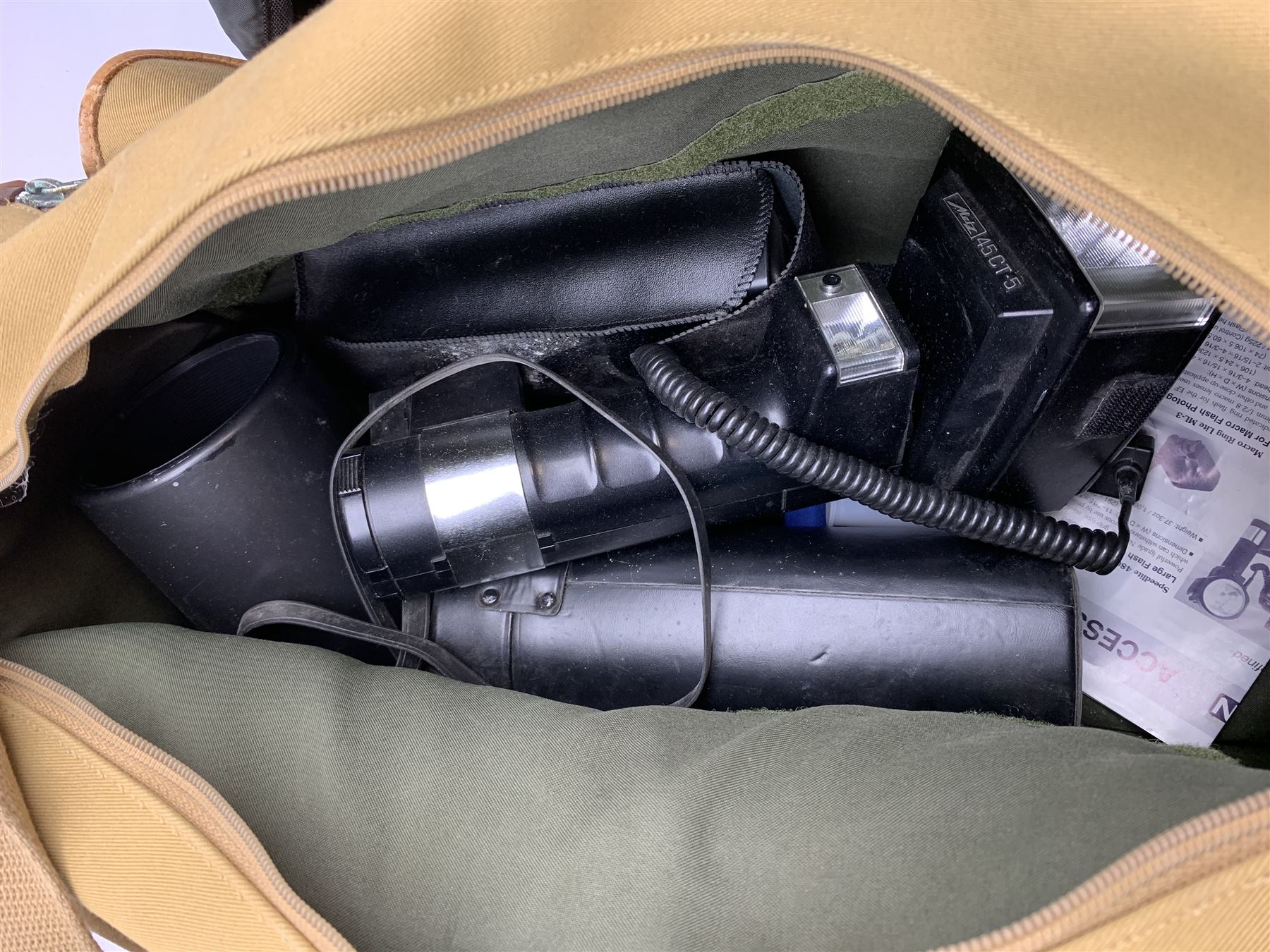 Canon EOS-1 camera body, Canon EOS-1N camera body, Tamron and Sigma camera lenses, two tripods, camera bags and various other accessories 