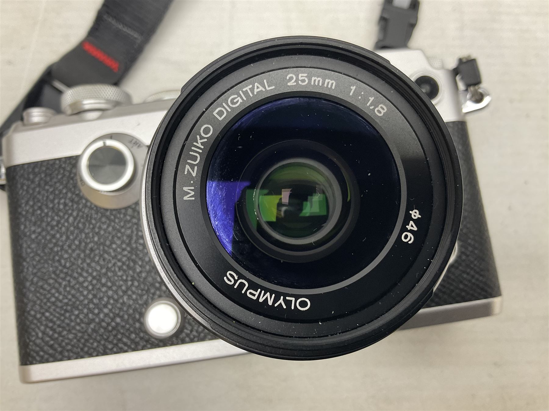 Olympus PEN-F camera body, with 'Olympus M- Zuiko Digital 25mm 1: 1.8' lens,  'Olympus M- Zuiko Digital 75-300mm 1: 4.8 - 6.7' lens and  'Olympus M- Zuiko Digital 17mm 1: 1.8' lens, with original box, together with Lowepro camera bag