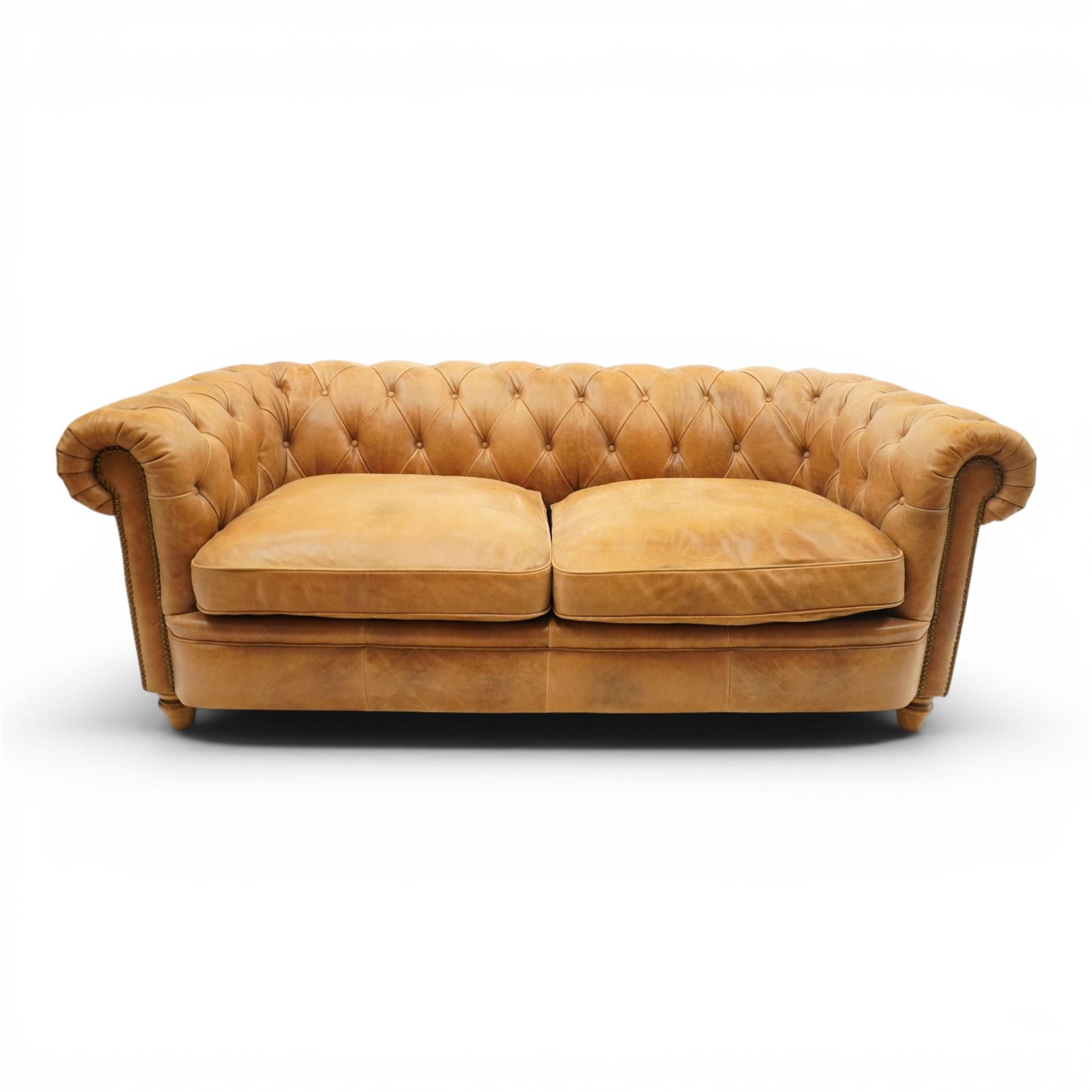 Alexander James - Chesterfield tan three seat sofa, button backed with scrolled arms, brass studded trim raised on light wood turned feet