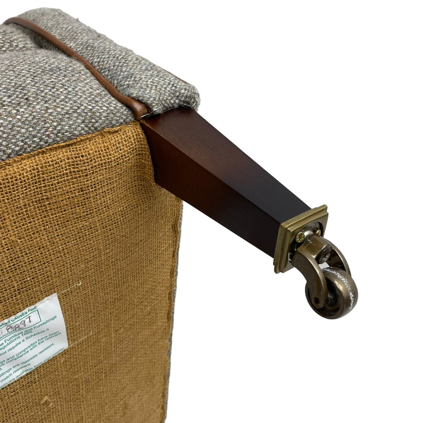 Interiors at Nine to Eleven - Edwardian design armchair, traditional shape with rolled arms, upholstered in 'Harris Tweed' fabric with leather piping, raised on square taping supports with castors