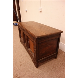  18th century oak coffer, planked top with moulded edge, front with central Tunbridge ware panel, frame carved with strapwork and foliage on shaped stile feet, W143cm, D58cm, H70cm  