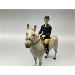 Beswick model of a huntswoman on grey horse model no 1730, and Beswick huntsman on brown horse model no 1501, both with printed mark beneath. 