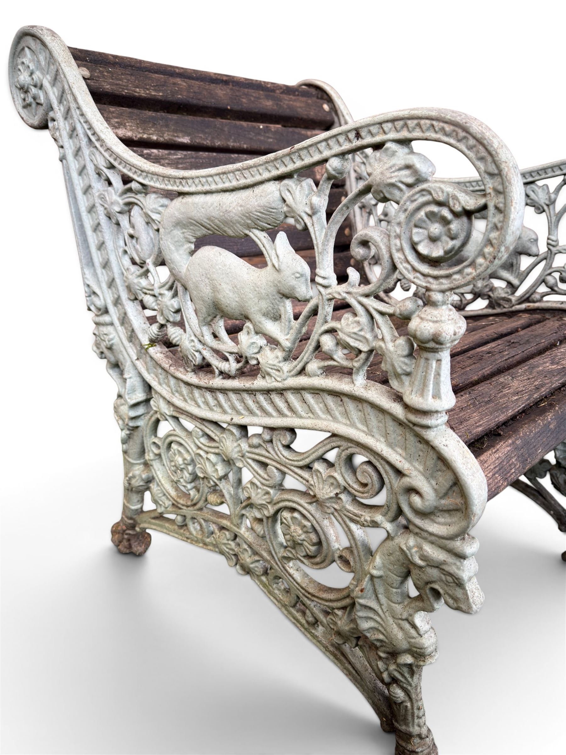 Pair of unusual Victorian revival heavy cast iron garden chair benches, ornate scrollwork detail with squirrels and nature, serpentine wood slatted seat and back - design by George Smith at the Sun Foundry, Glasgow