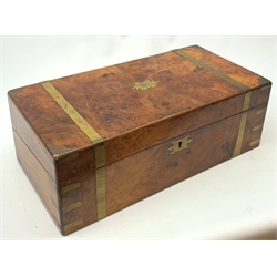 A Victorian walnut and brass banded writing slope, the hinged cover with vacant brass cartouche, opening to reveal a plush lined slop and compartmented interior, H17.5cm L50cm.
